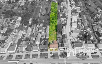 Na predaj rozsiahly investičný pozemok s polyfunkčným domom