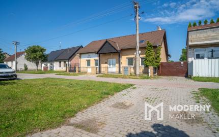 Na predaj rozsiahly investičný pozemok s polyfunkčným domom